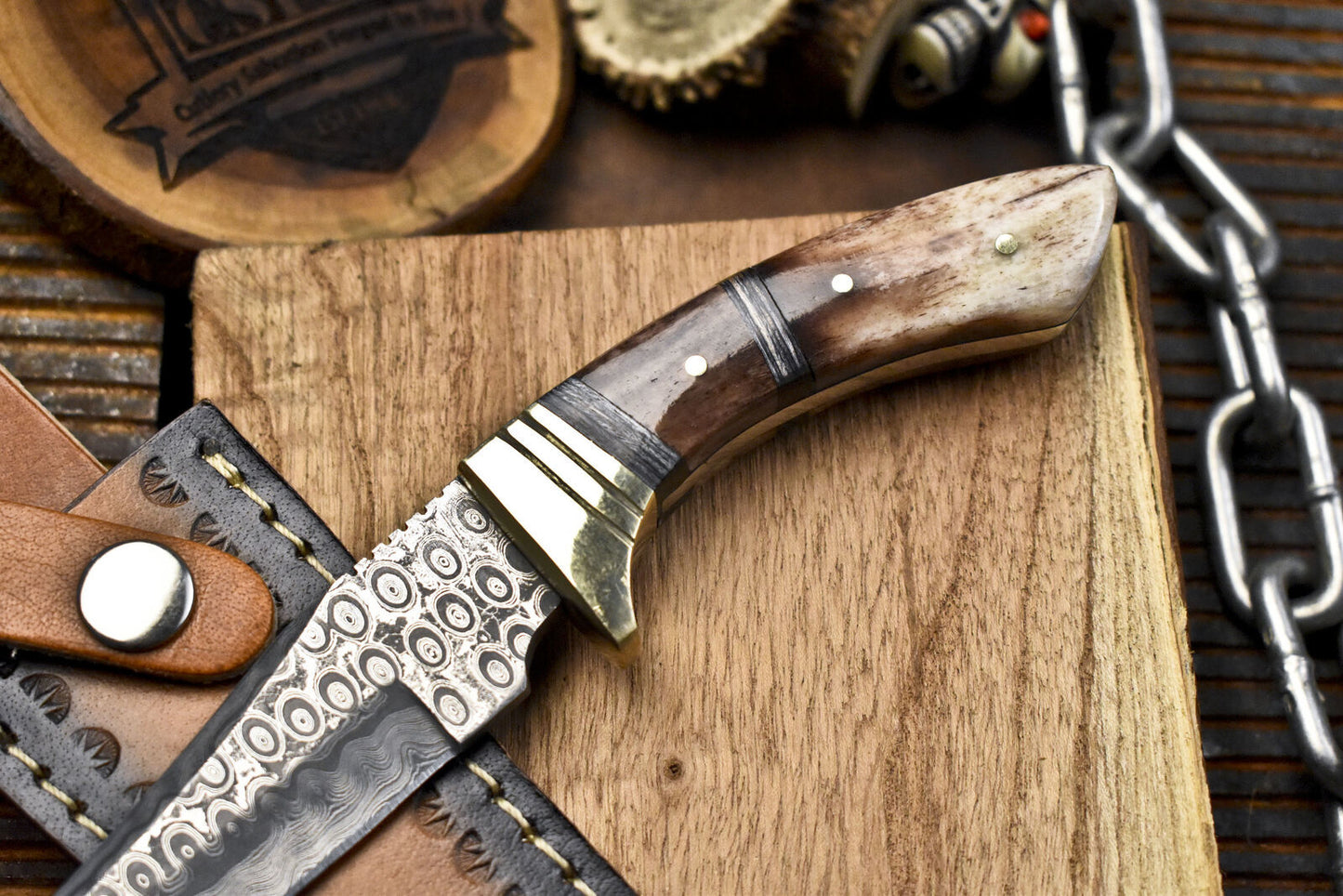 Forged Rain Drop Damascus Skinner Knife – Bone Handle with Brass Guard and Leather Sheath