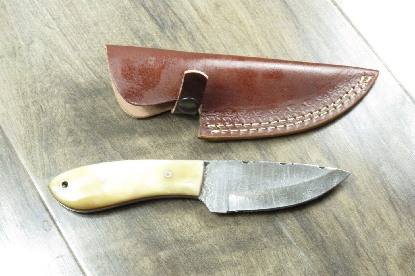 8.25" Damascus Steel Skinner Knife – Bone Handle, Stainless Bolster, Leather Sheath