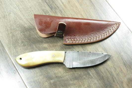 8.25" Damascus Steel Skinner Knife – Bone Handle, Stainless Bolster, Leather Sheath