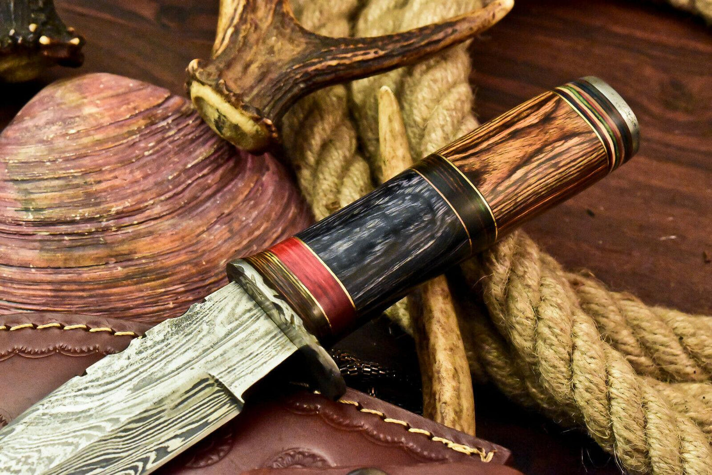 Damascus steel hunting knife blade closeup, forged pattern