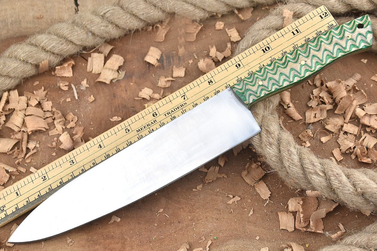 Featuring a smooth polished steel blade and a distinctive green zigzag patterned handle with a lanyard hole.