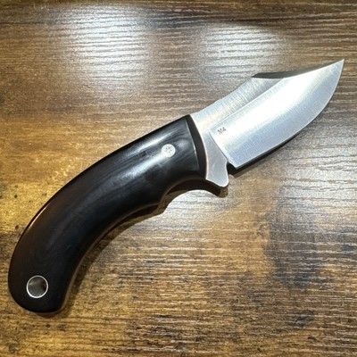 3.5-inch clip point skinner knife with a full tang stainless steel blade and custom wood handle.