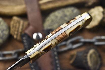 Custom Twist Damascus Skinner Knife with Bone Handle and Brass Guard – Handmade Tactical Knife with Sheath