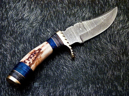 Hunting knife with genuine stag antler handle and Damascus steel blade, full view