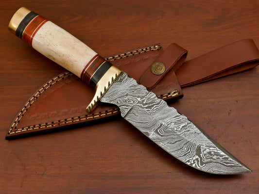 Brass guard with notch filework on Damascus hunting knife