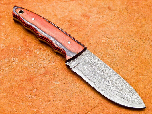 Close up of Damascus steel skinner blade with layered pattern