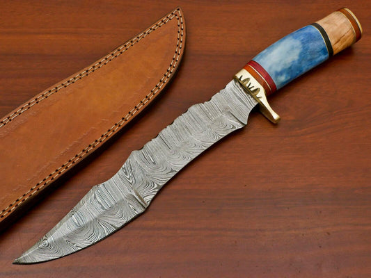 Leather sheath alongside Damascus bowie knife, full length view