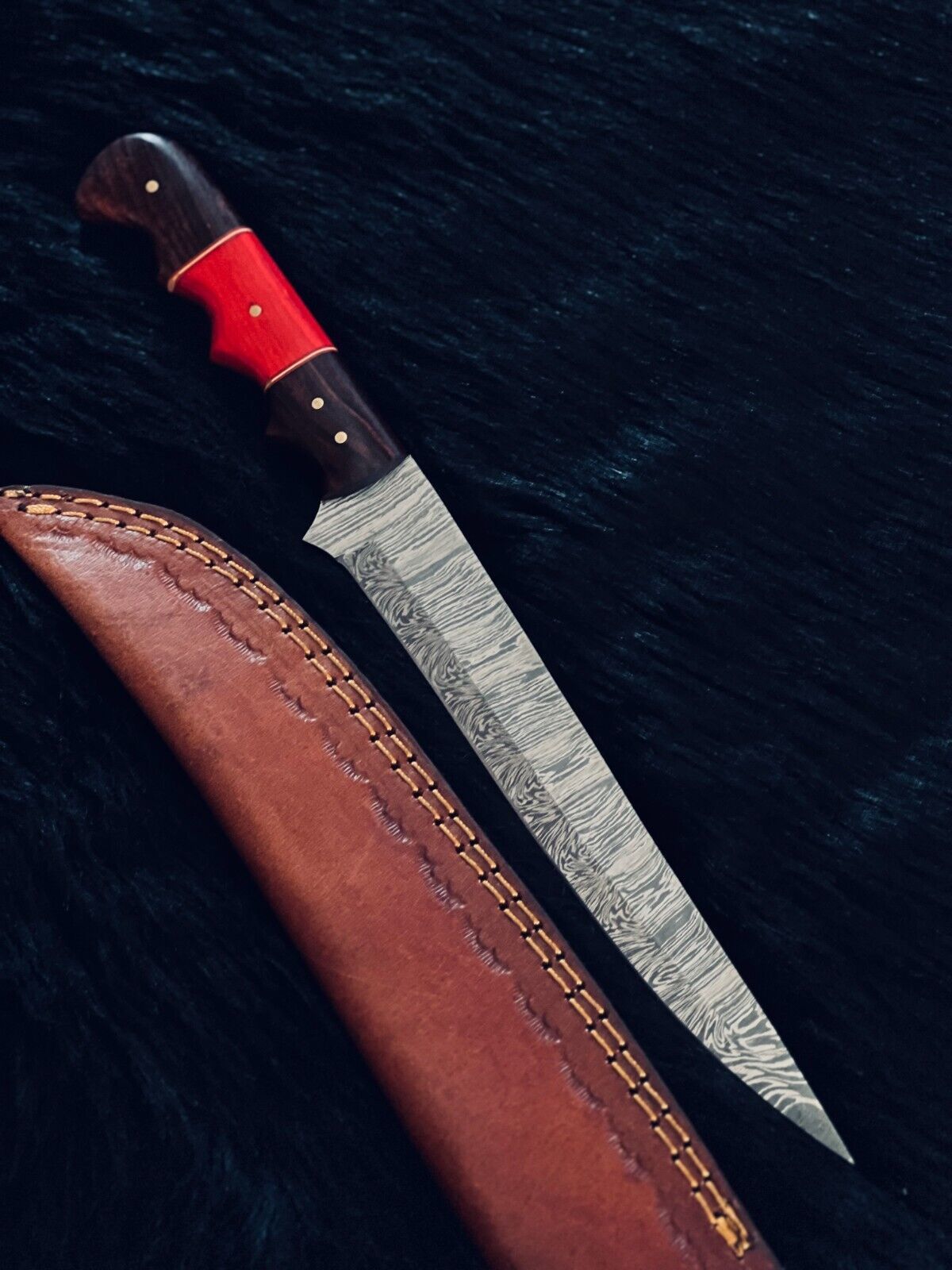 Close up of hand forged Damascus pattern on fillet knife blade