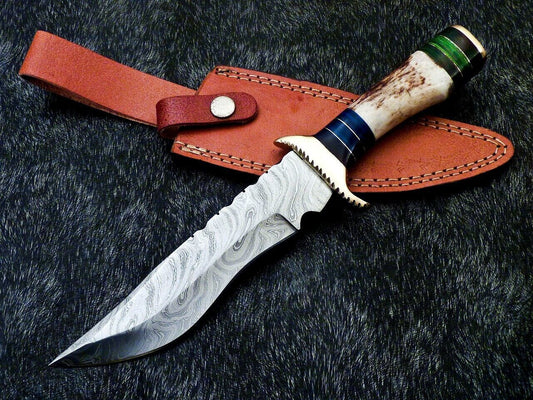 Damascus steel blade closeup showing hand forged watered pattern on hunting knife