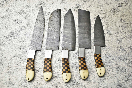 Close up of Damascus knife blade pattern and checkered handle detail