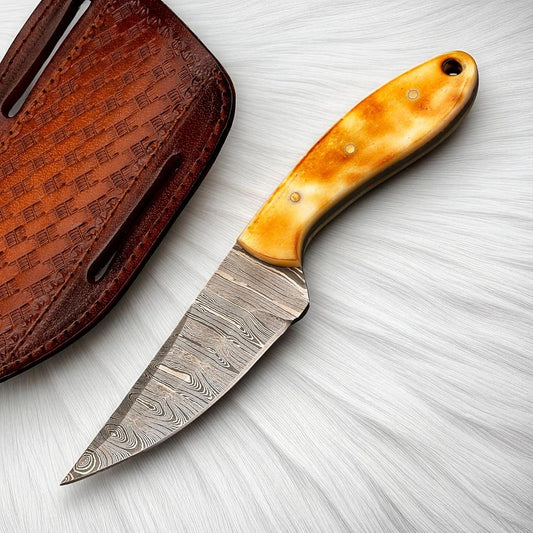 Handmade Damascus cowboy skinner knife with a 4-inch patterned blade and bone handle